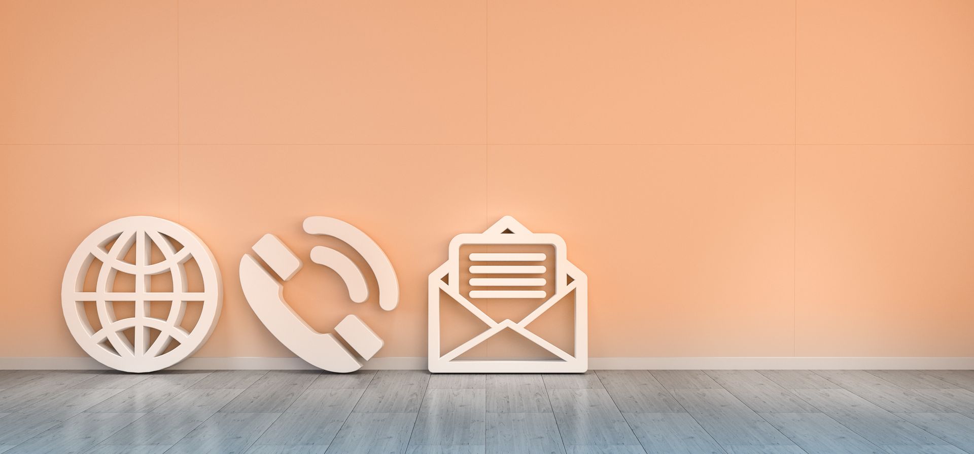 Eine Reihe von Kontaktsymbolen auf einem Holzboden vor einer Wand.