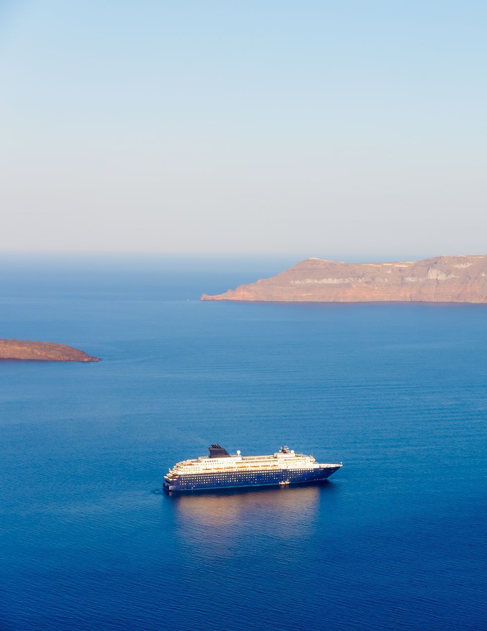 A cruise ship is floating on top of a large body of water.