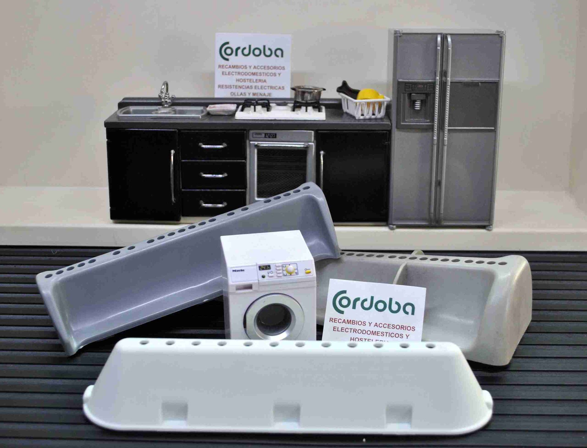 Una cocina con electrodomésticos y un cartel que dice cordoba