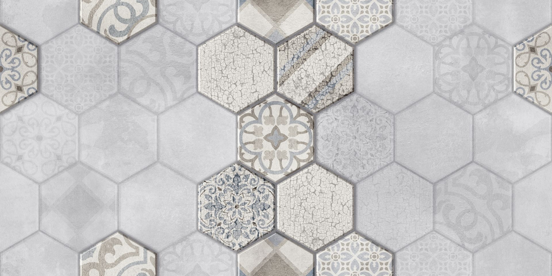 Carreaux hexagonaux aux motifs et nuances variés de blanc, gris et beige.