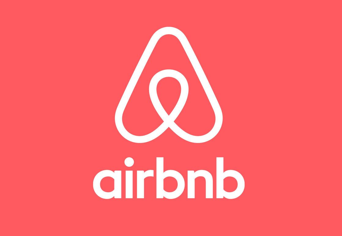 Airbnb logo: white stylized house icon with a loop over 