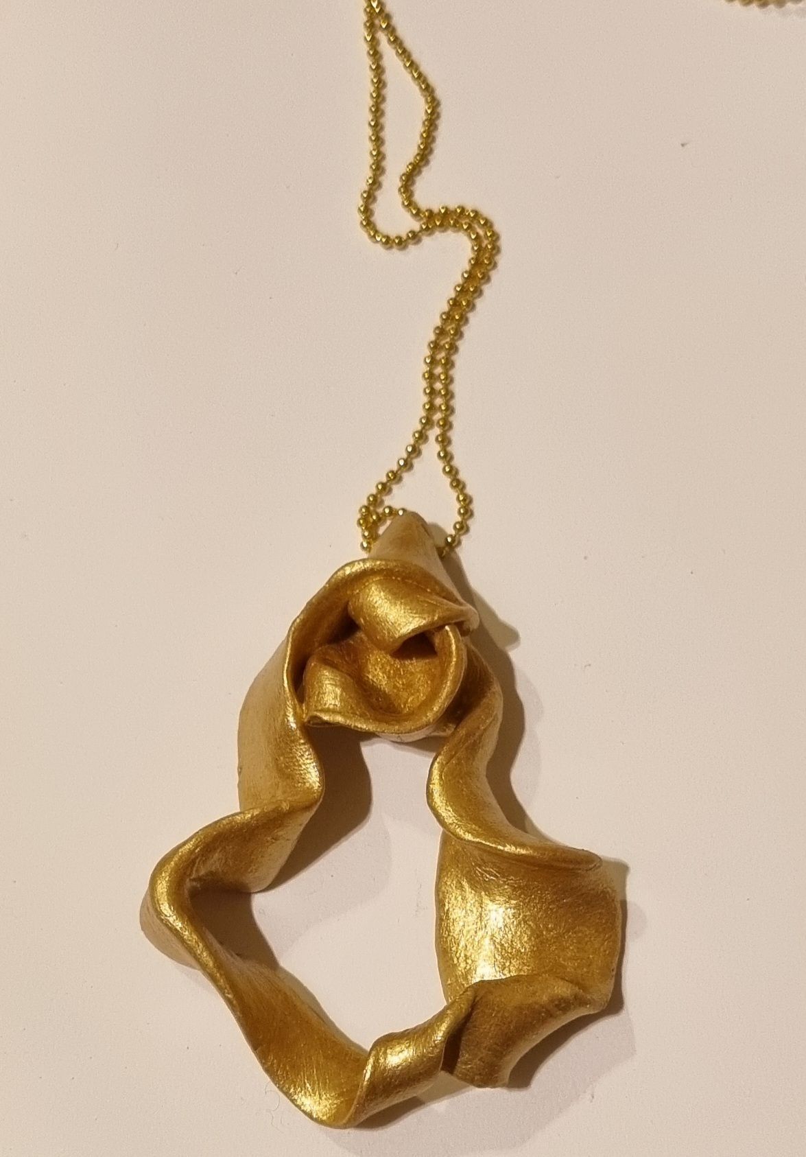 Pendentif or polymère