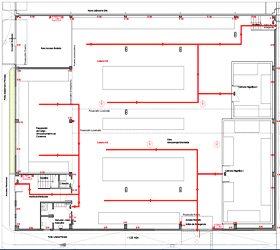 Un plano de un edificio con líneas rojas.