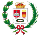 Escudo de armas decorativo de estilo español con corona, corona de laurel y cinta roja sobre fondo blanco.