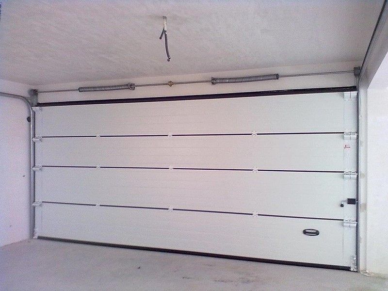  portões seccionados e automatismos