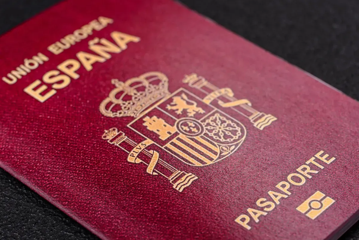 Spanish passport, red cover with gold emblem and text 