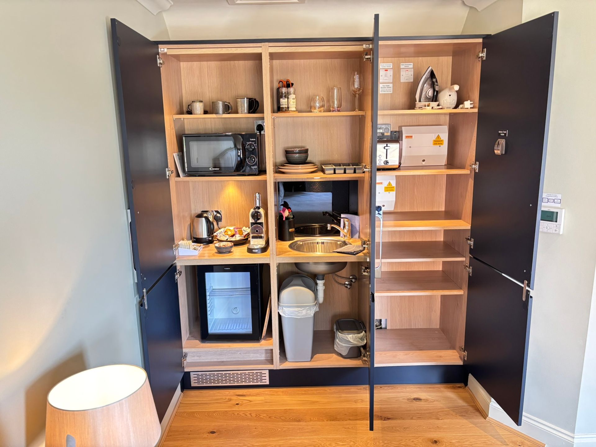 Image shows the layout of the Kitchenette at Hillside Farm apartments with Microwave, Fridge, Coffee Machine, Toaster and Kettle