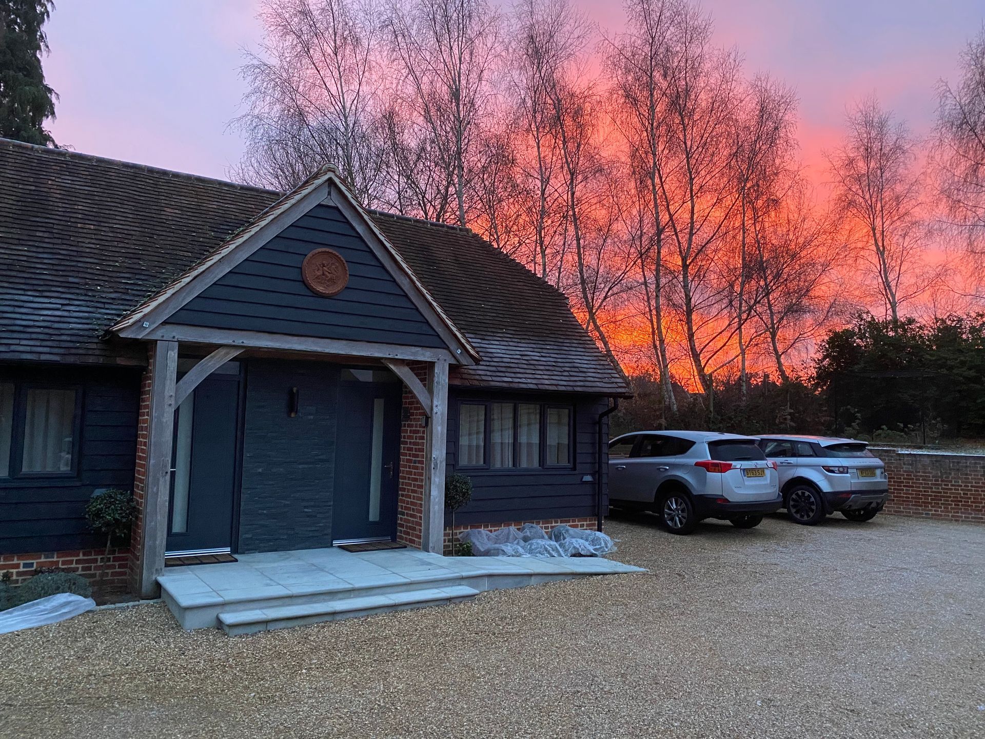 Image shows secure parking spaces to the side of Hillside Farm Barn Apartments