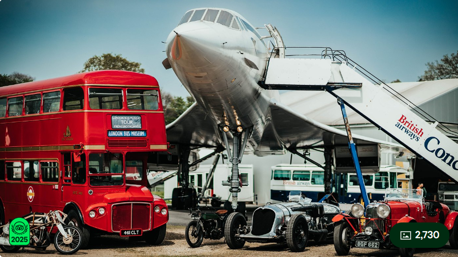 Image shows Concorde, a double decker London bus and some old cars  