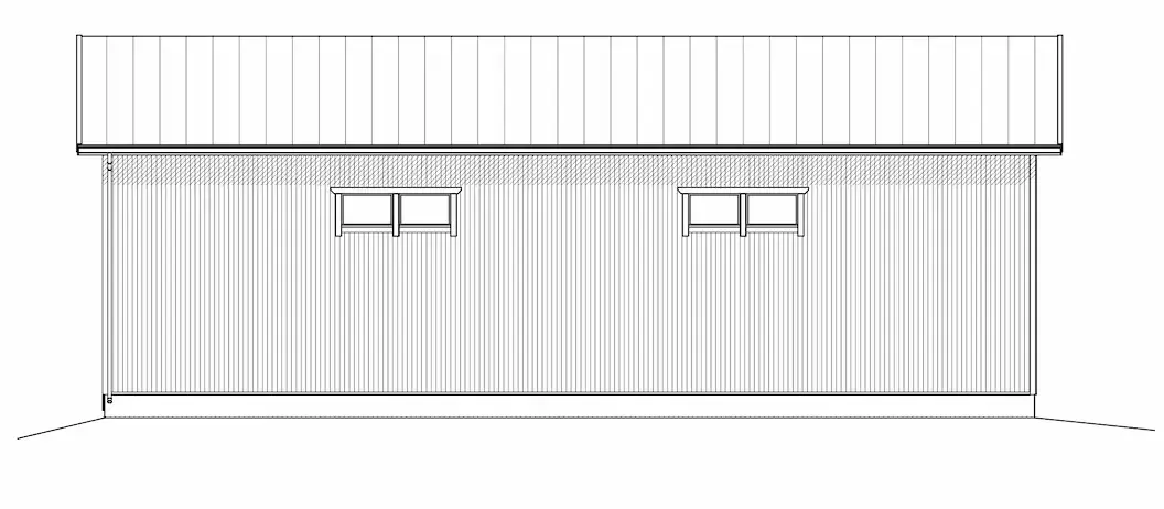 En byggnad med plåttak och två uppsättningar fönster.