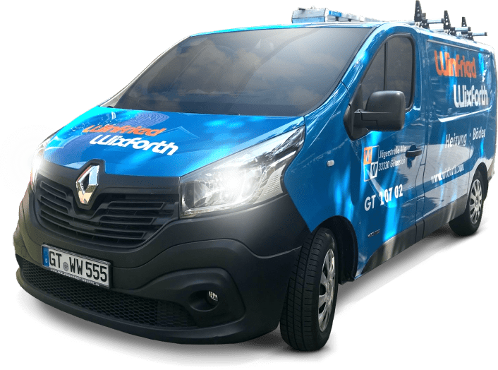 Blauer Renault Trafic Transporter mit „Clifford Worth“-Aufdruck.