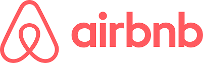 El logotipo de Airbnb es rojo y blanco sobre un fondo blanco.