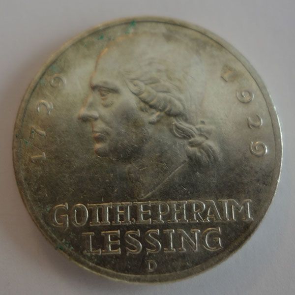 Münze mit einem Profil von Gotthold Ephraim Lessing, 1729-1929, silberfarben, Text „GOTHEPHRAIM LESSING“.
