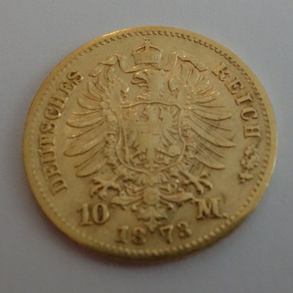 Goldene 10-Mark-Münze von 1878 mit Adleremblem, Krone und deutschem Text.
