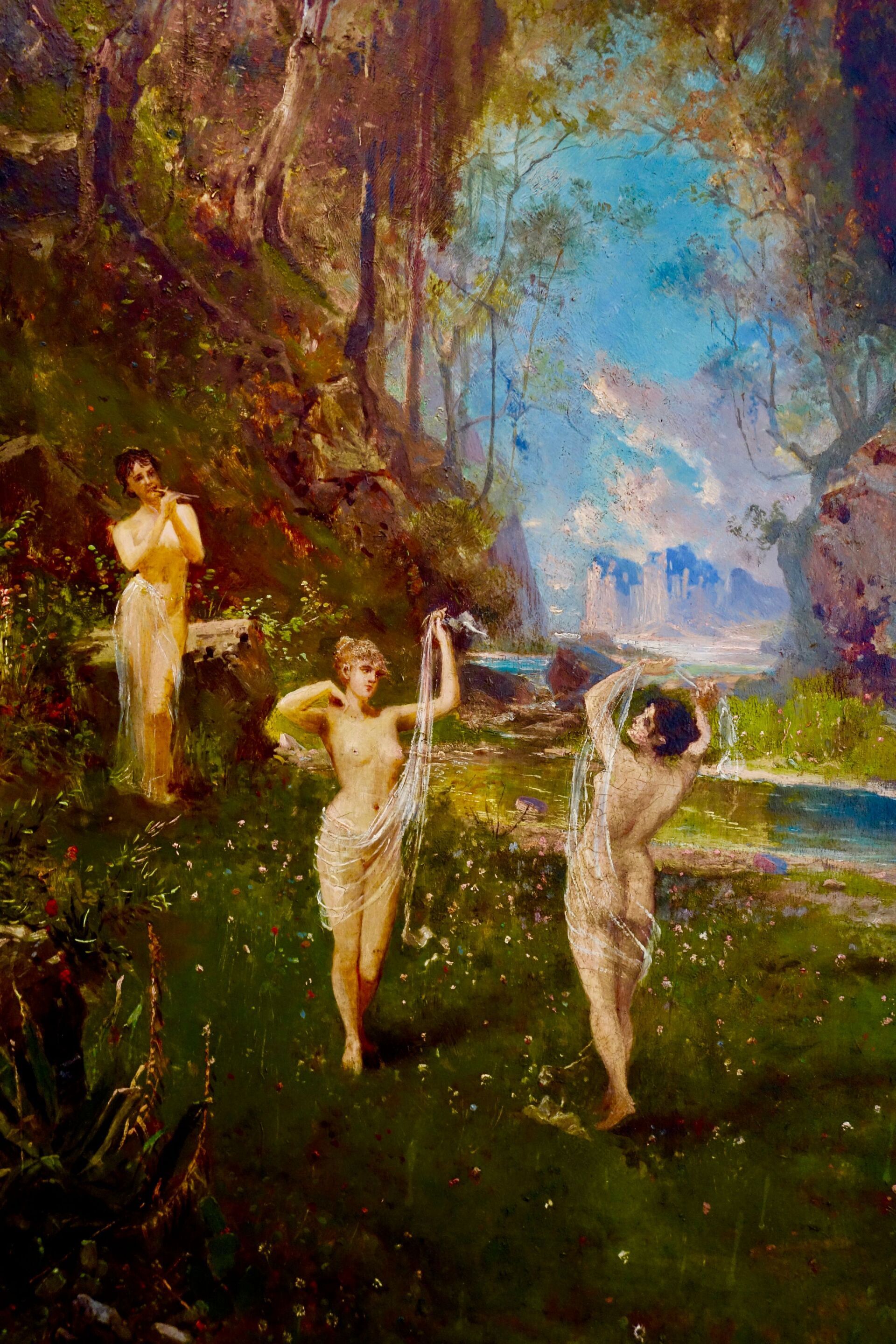 Drei Figuren tanzen auf einer blühenden Wiese in der Nähe eines Bachs und Waldes, beleuchtet von einem blauen Himmel.