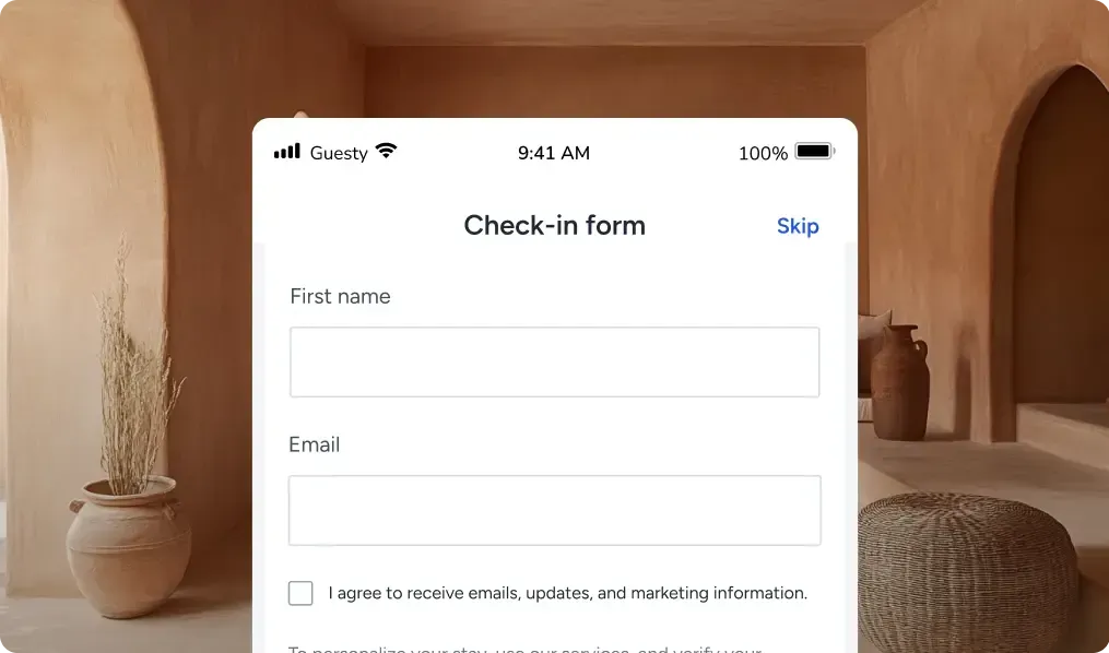IPhone screen showing a “Check in form” with name and email fields on a beige room background