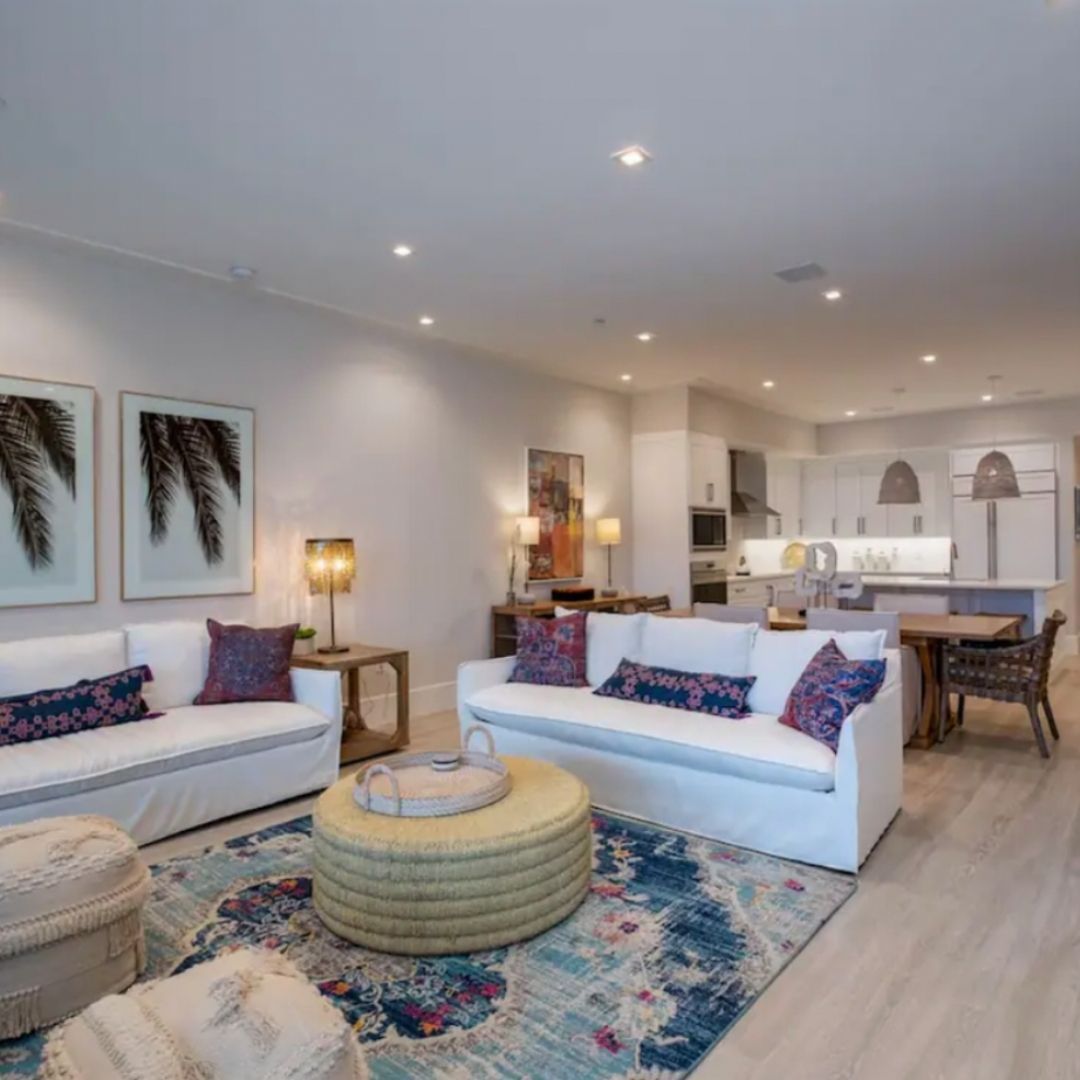 Spacious coastal living room with soft furnishings and island-inspired décor.