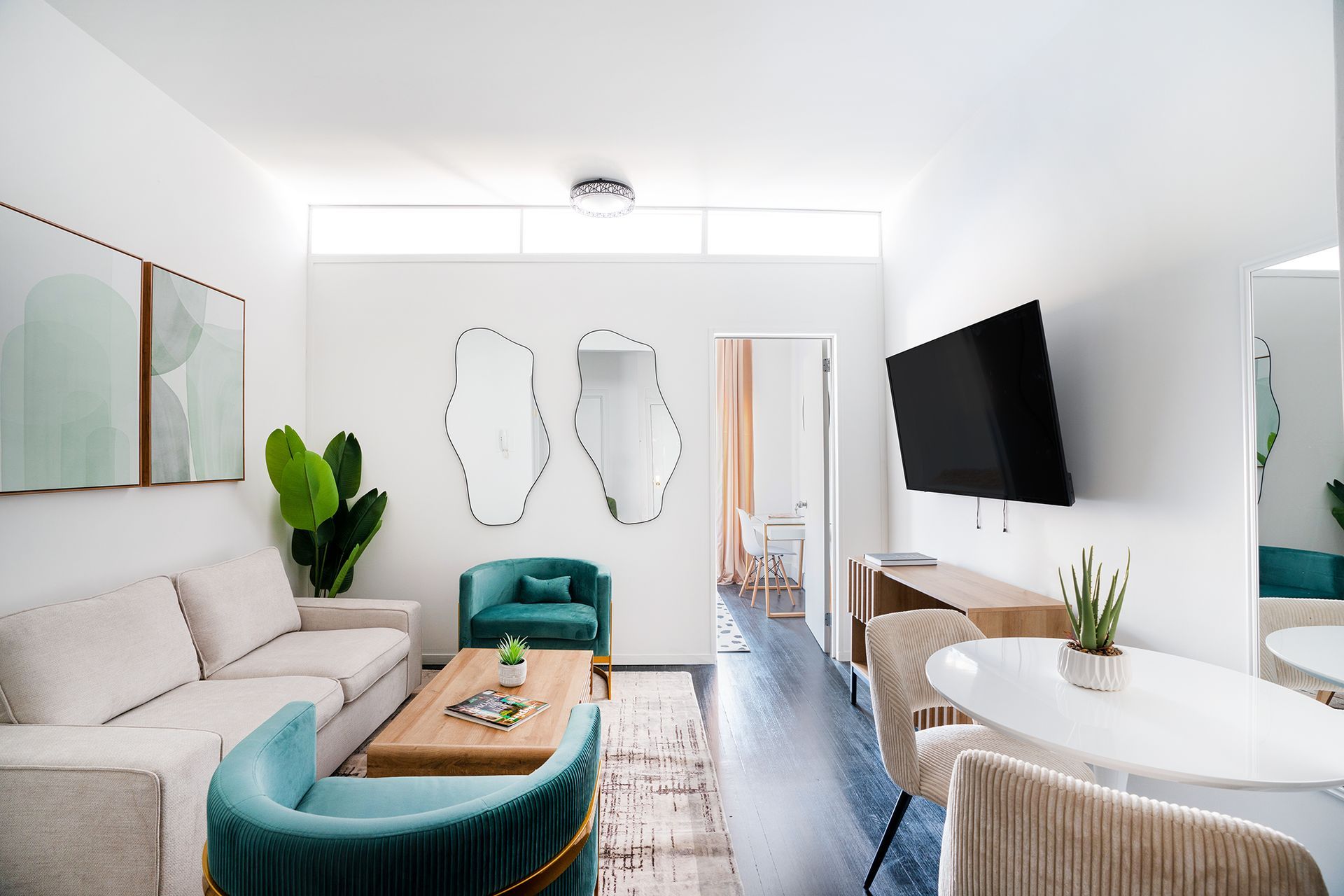 Elegant one-bedroom apartment featuring stylish decor, modern furniture, and a cozy seating area. Located in Midtown West.