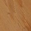 Gros plan sur une surface en bois brun clair avec une texture de grain visible