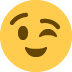 Émoji visage jaune clignant de l'œil avec un léger sourire