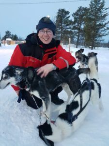 Mike with a husky in Lapland
