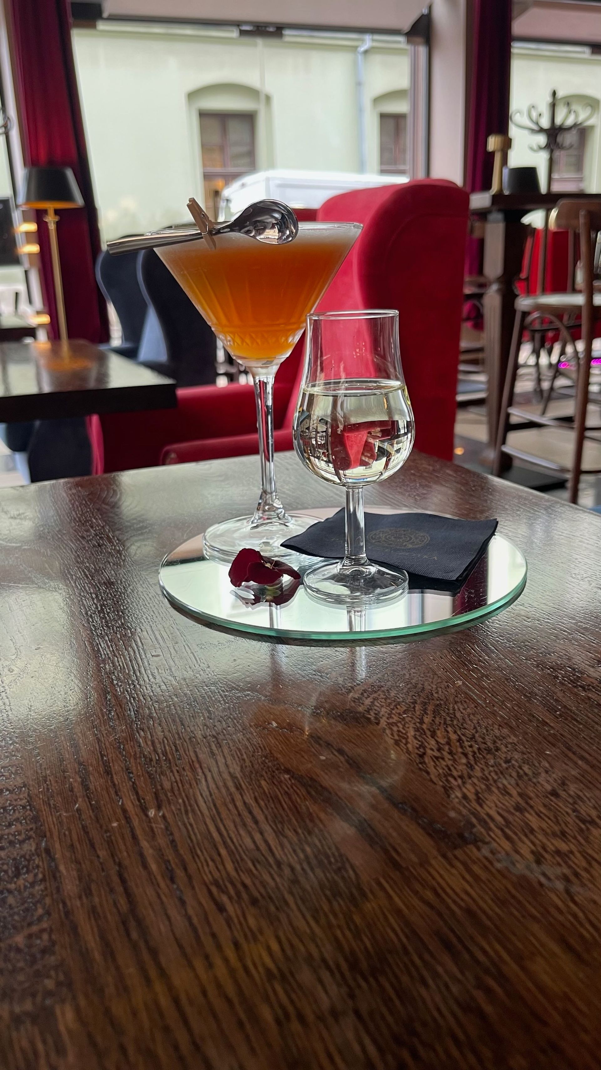 Two cocktails on a table. 
