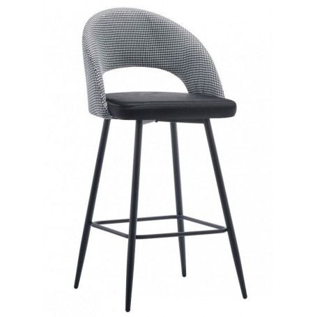 Un taburete de bar verde con un asiento a cuadros blancos y negros.