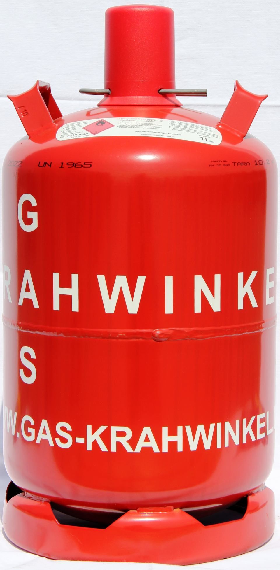 11 kg Pfandflasche, eine rote Gasflasche mit der Aufschrift gas krahwinkel