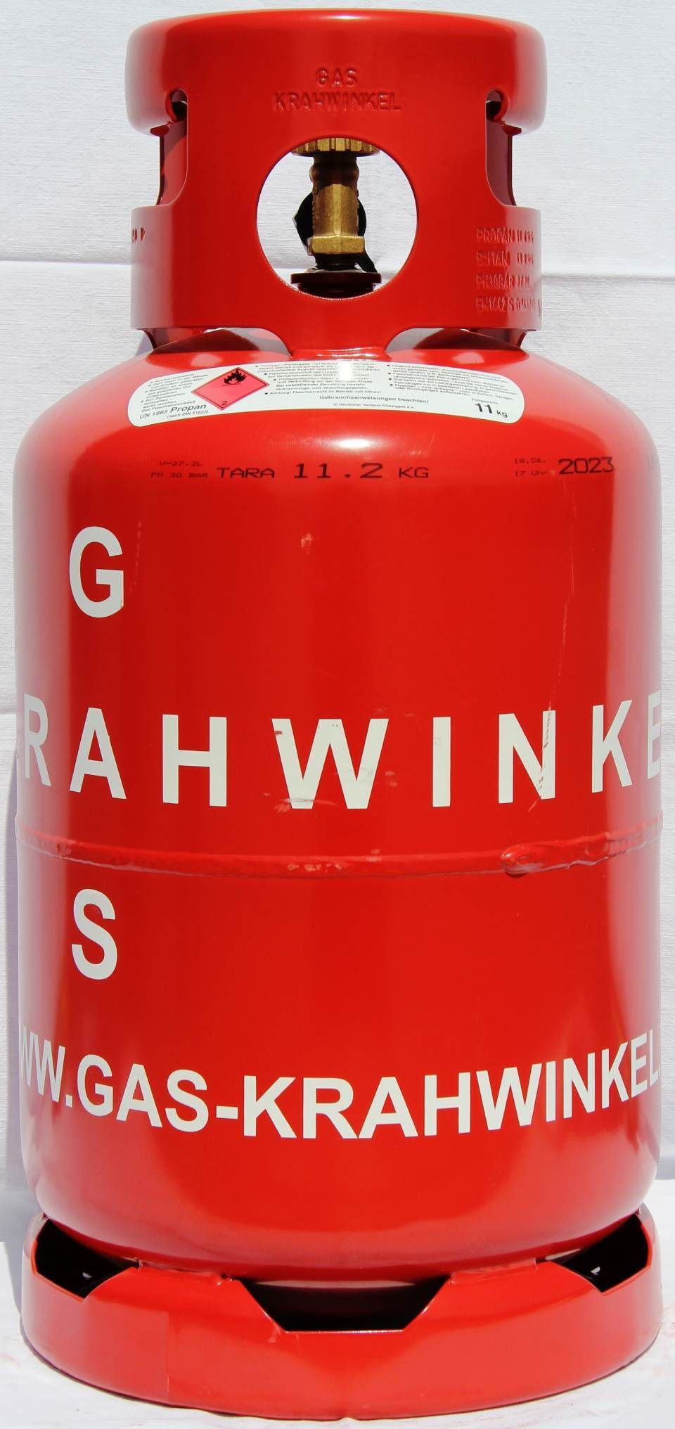 11 kg Pfandflasche, eine rote Gasflasche mit der Aufschrift gas krahwinkel