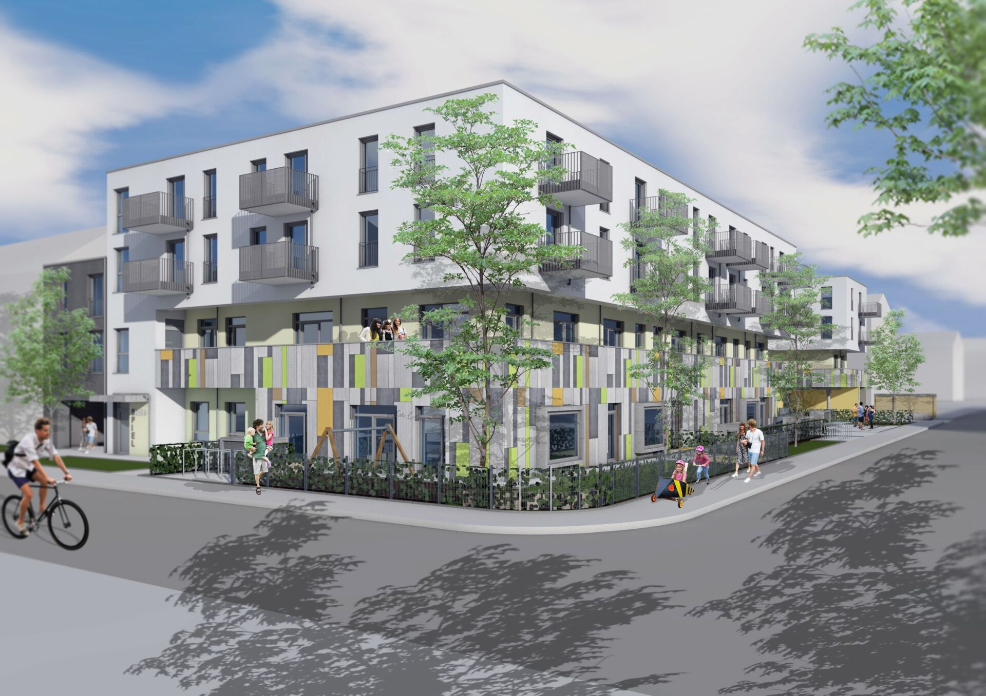 Eine Frau fährt vor einem großen Gebäude Fahrrad.