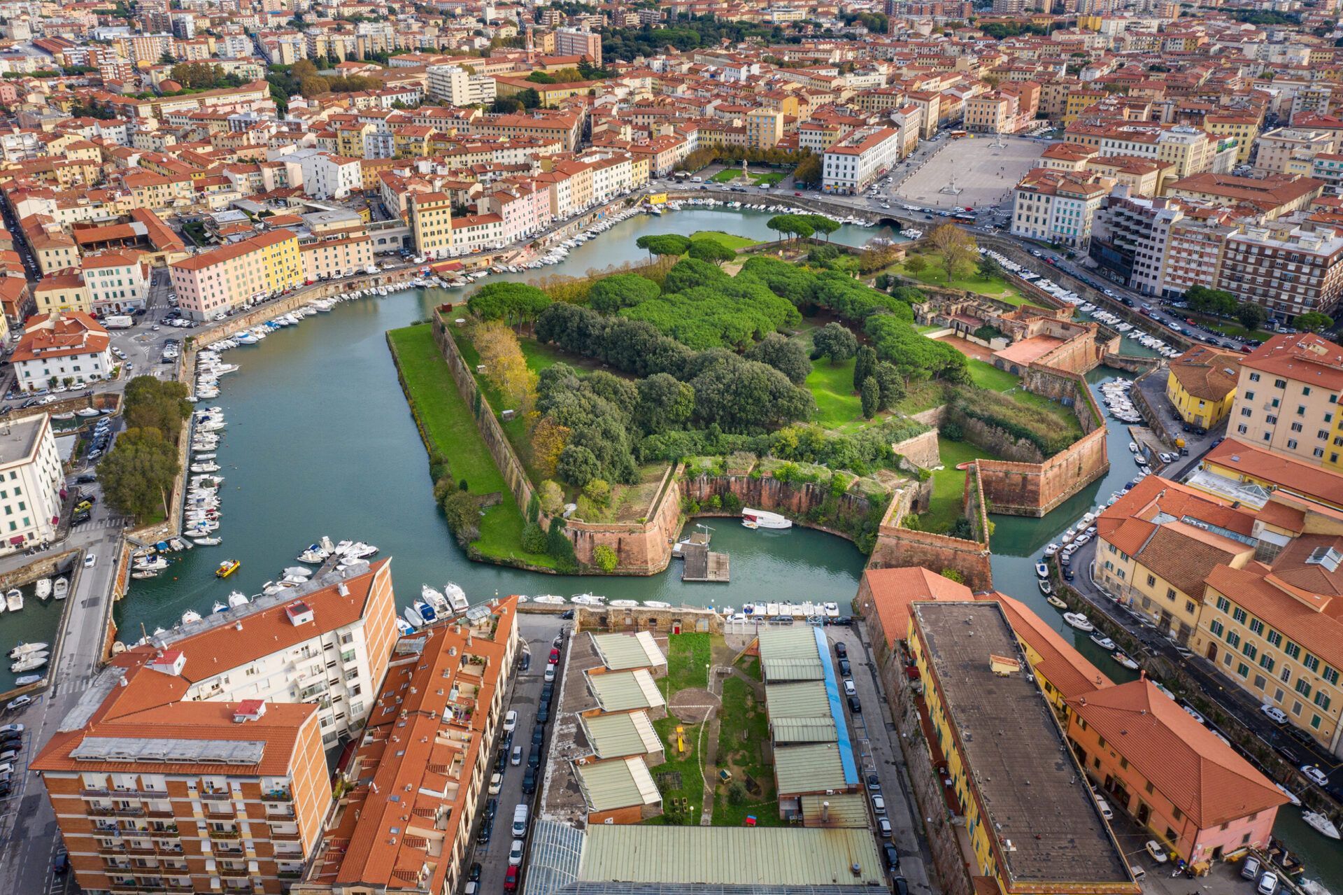 An aerial view of a city with a large island in the middle of the city.