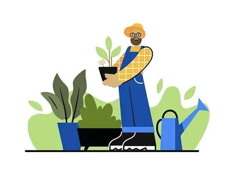 Un hombre sostiene una planta en maceta al lado de una regadera.