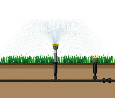 Un diagrama de un sistema de rociadores que rocía agua sobre un césped.