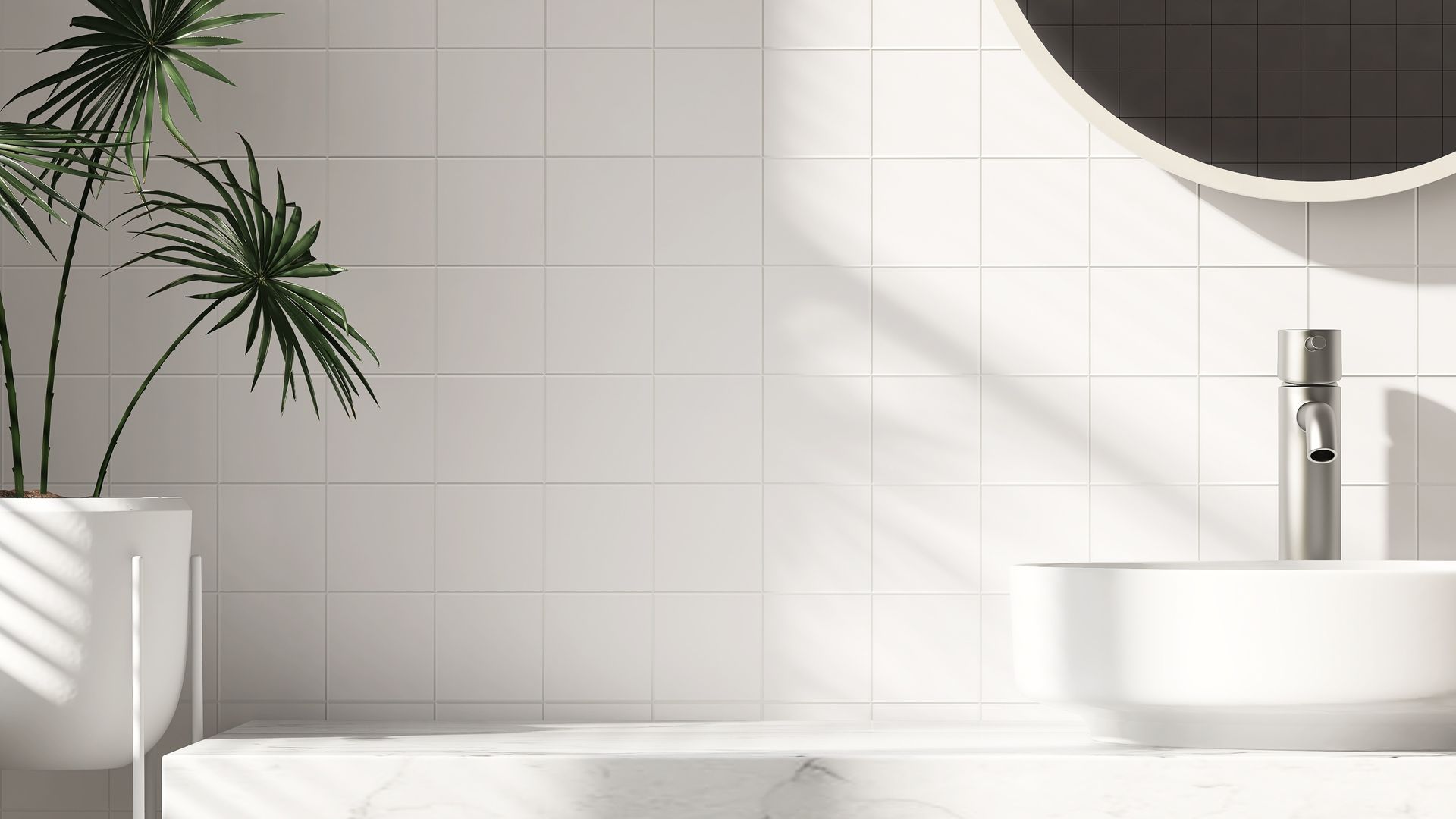 Un carrelage mural et un vasque blancs