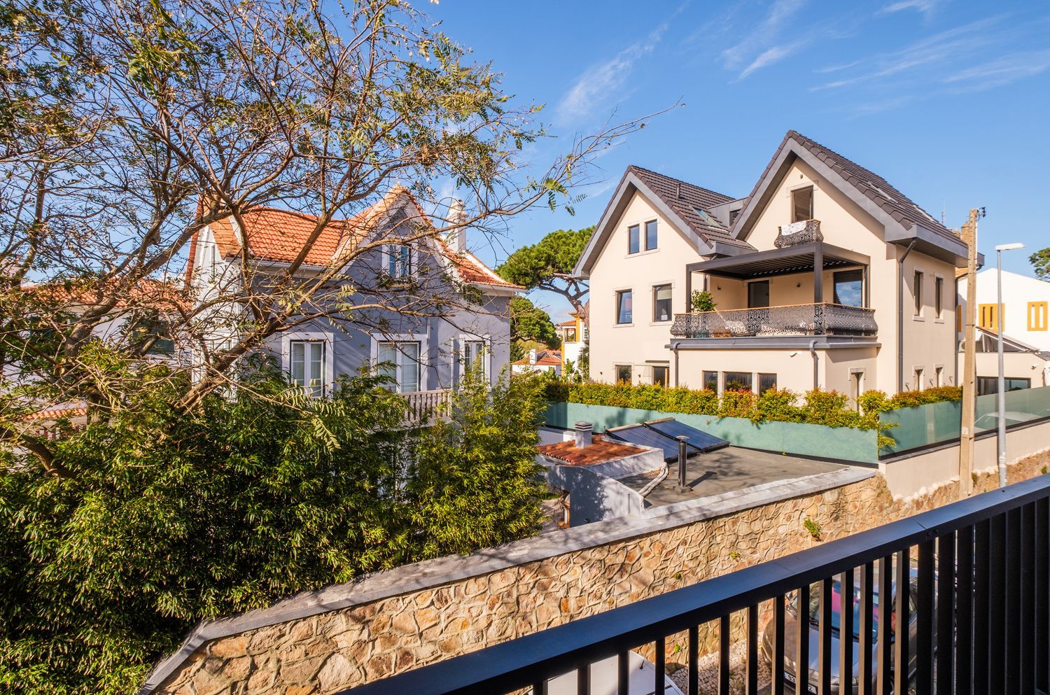 A view of a large house from a balcony.