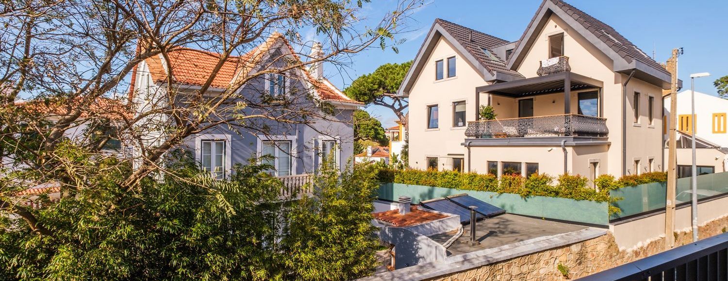  An aerial view of Lisbon's houses showcasing beautifully maintained properties managed by PortugalPortfolio, a leader in enhancing investor returns.