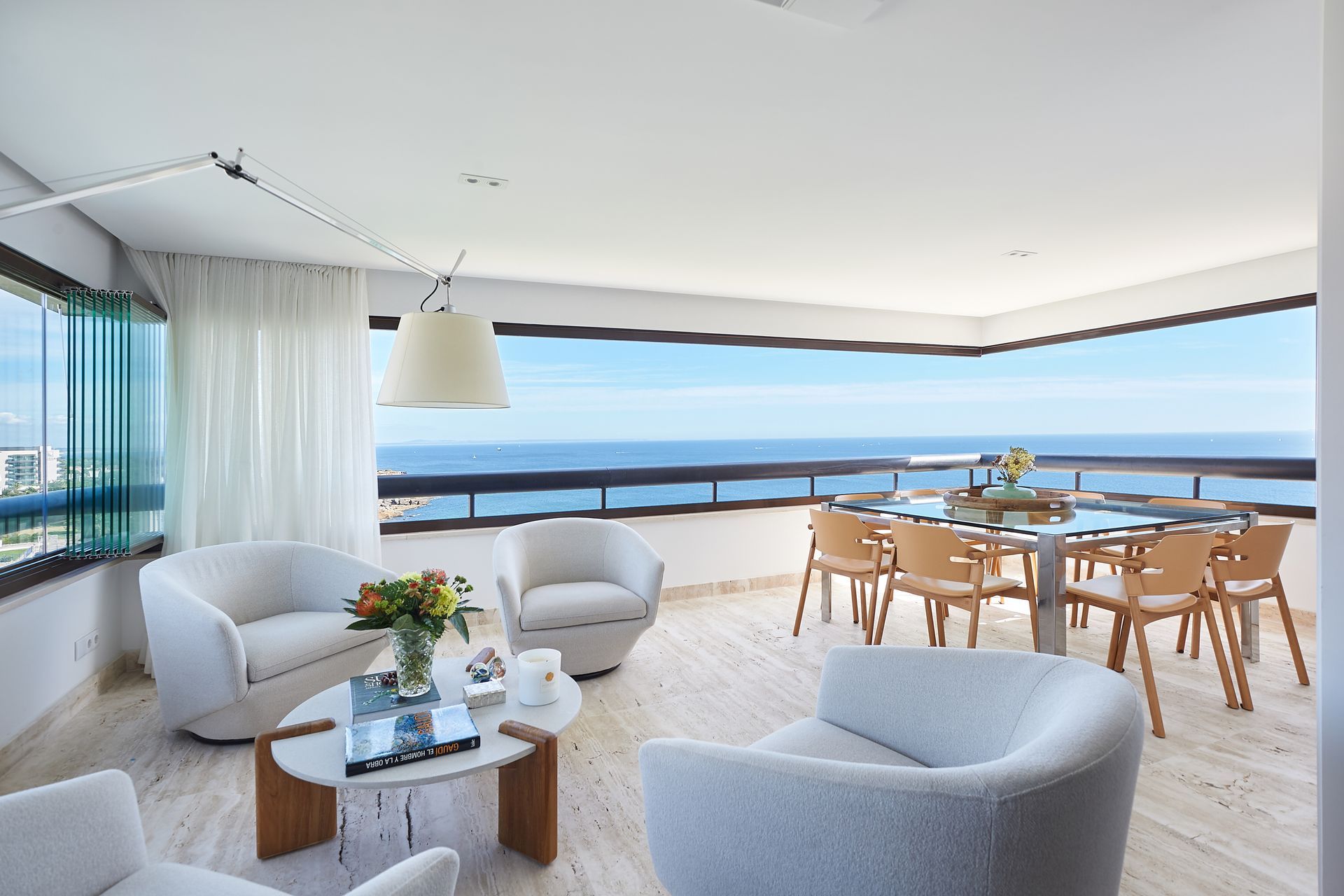 The living room of a Portugal Portfolio home with an ocean view