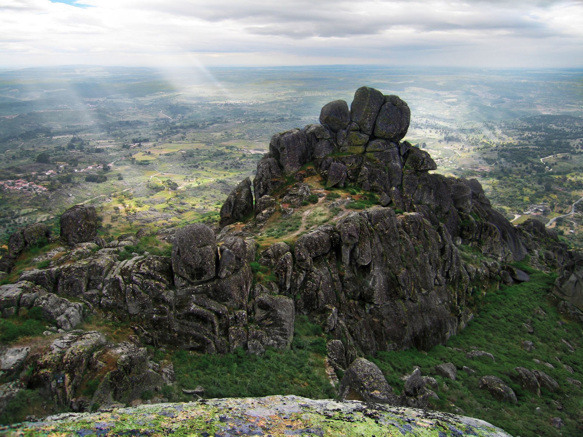 A view of a valley from the top of a mountain.