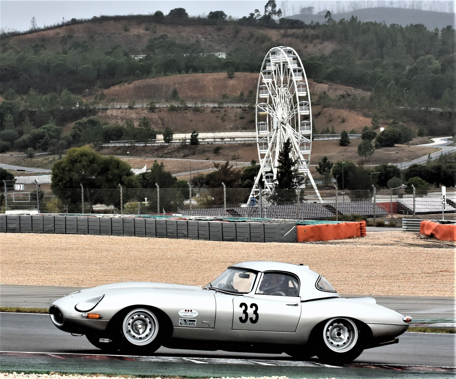 A silver car with the number 33 on it