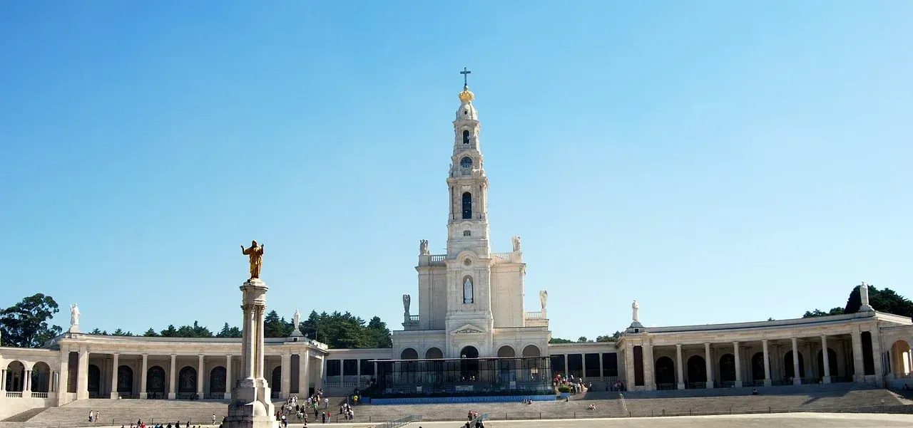 A large white building with a clock tower on top of it