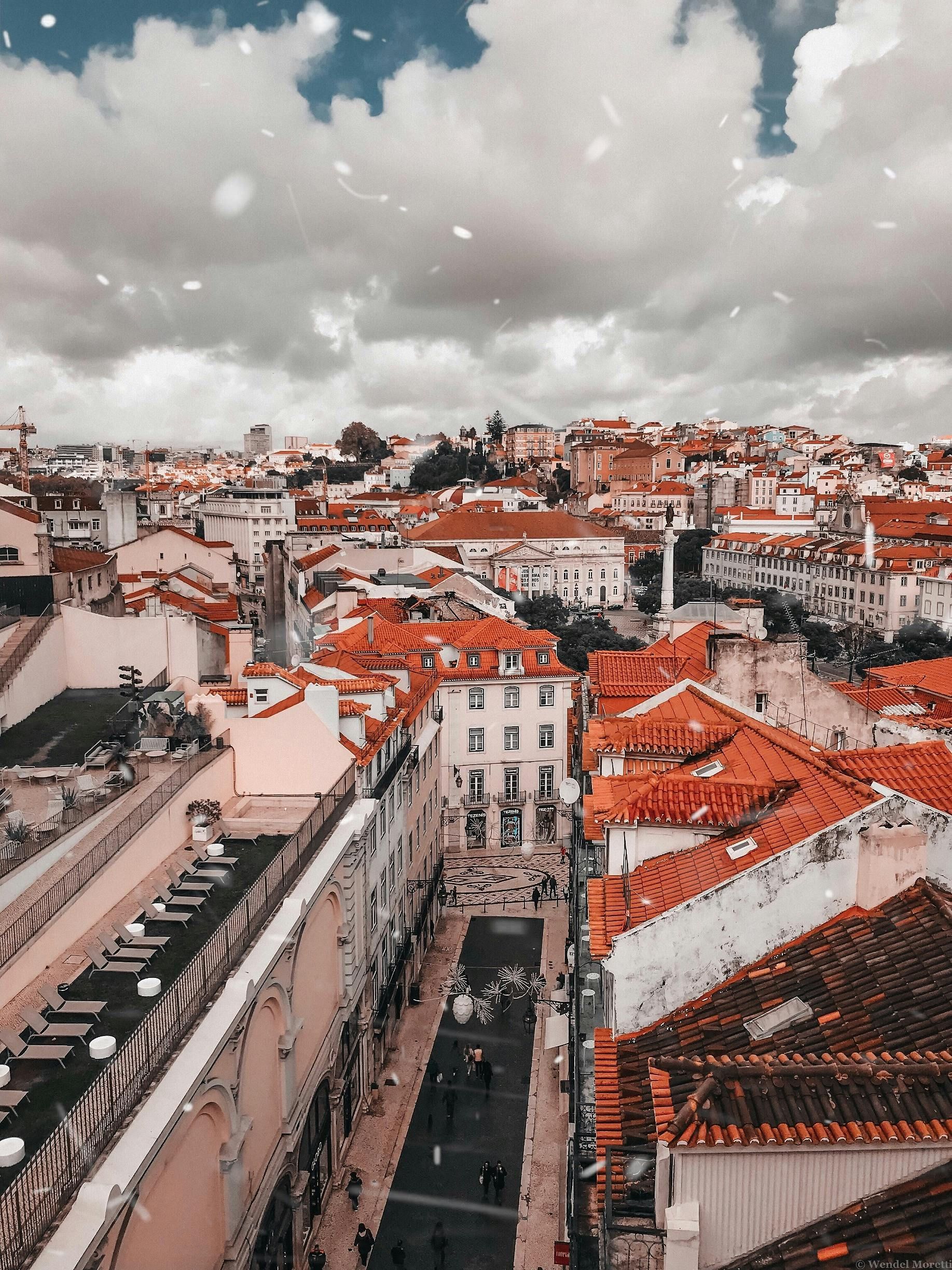 An aerial view of a city with red tiled roofs