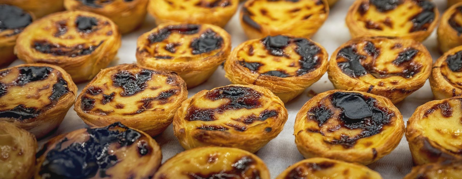 A bunch of pastries are sitting on top of each other on a table.