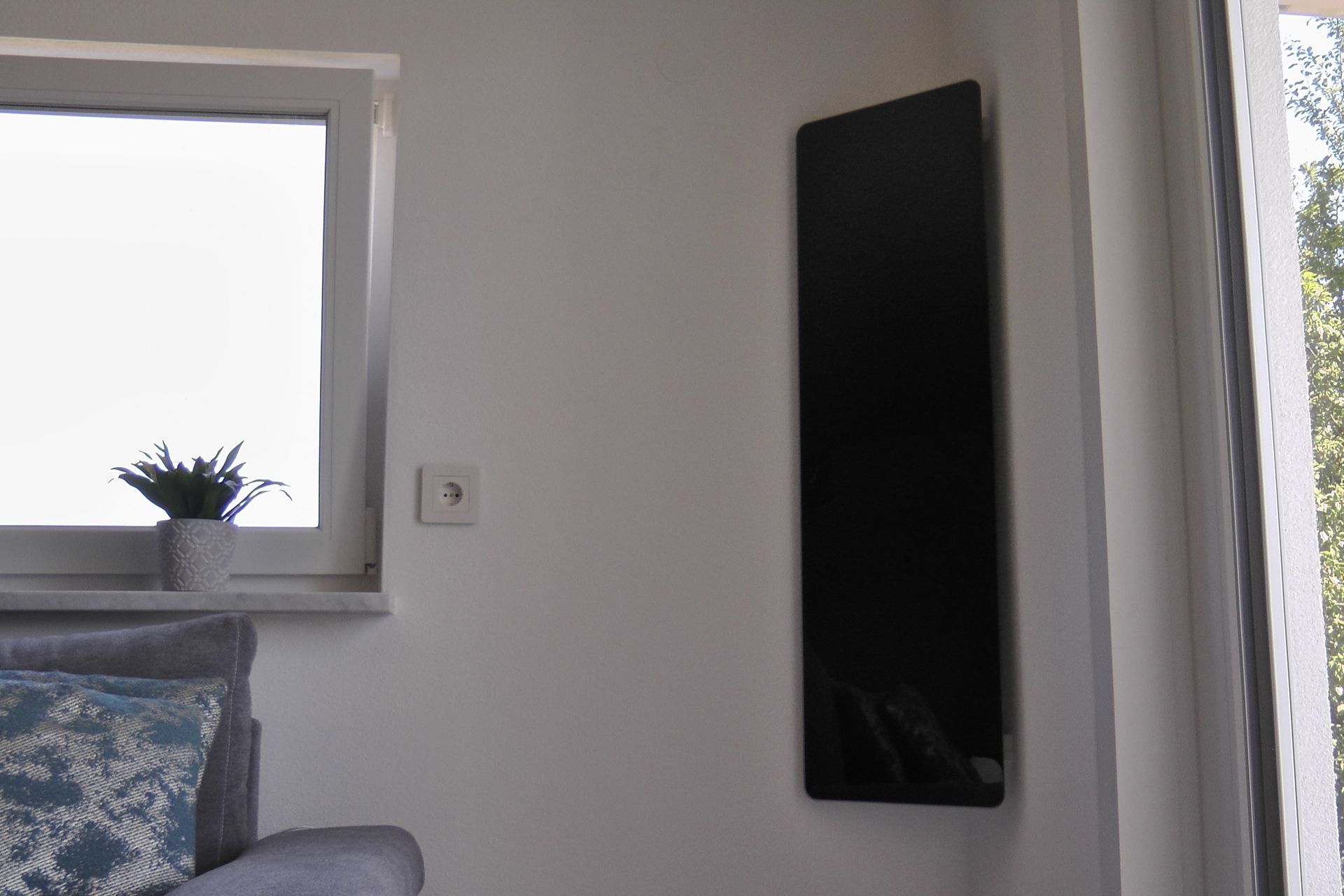 Celsius Infrarotheizung Eckmontage im Wohnzimmer