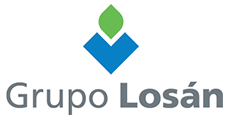 Un logotipo azul y verde para Grupo Losan con un corazón en el medio.