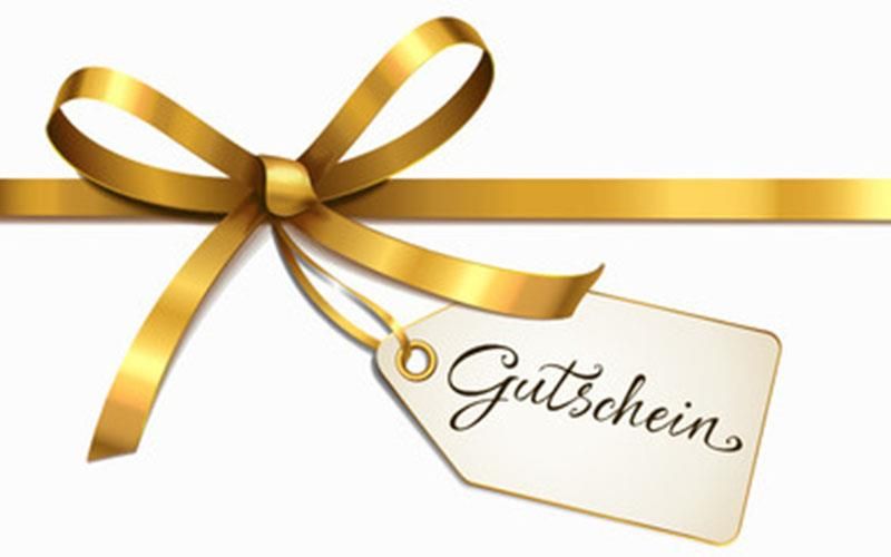 Ein goldenes Band mit einem Schild mit der Aufschrift „Gutschein“