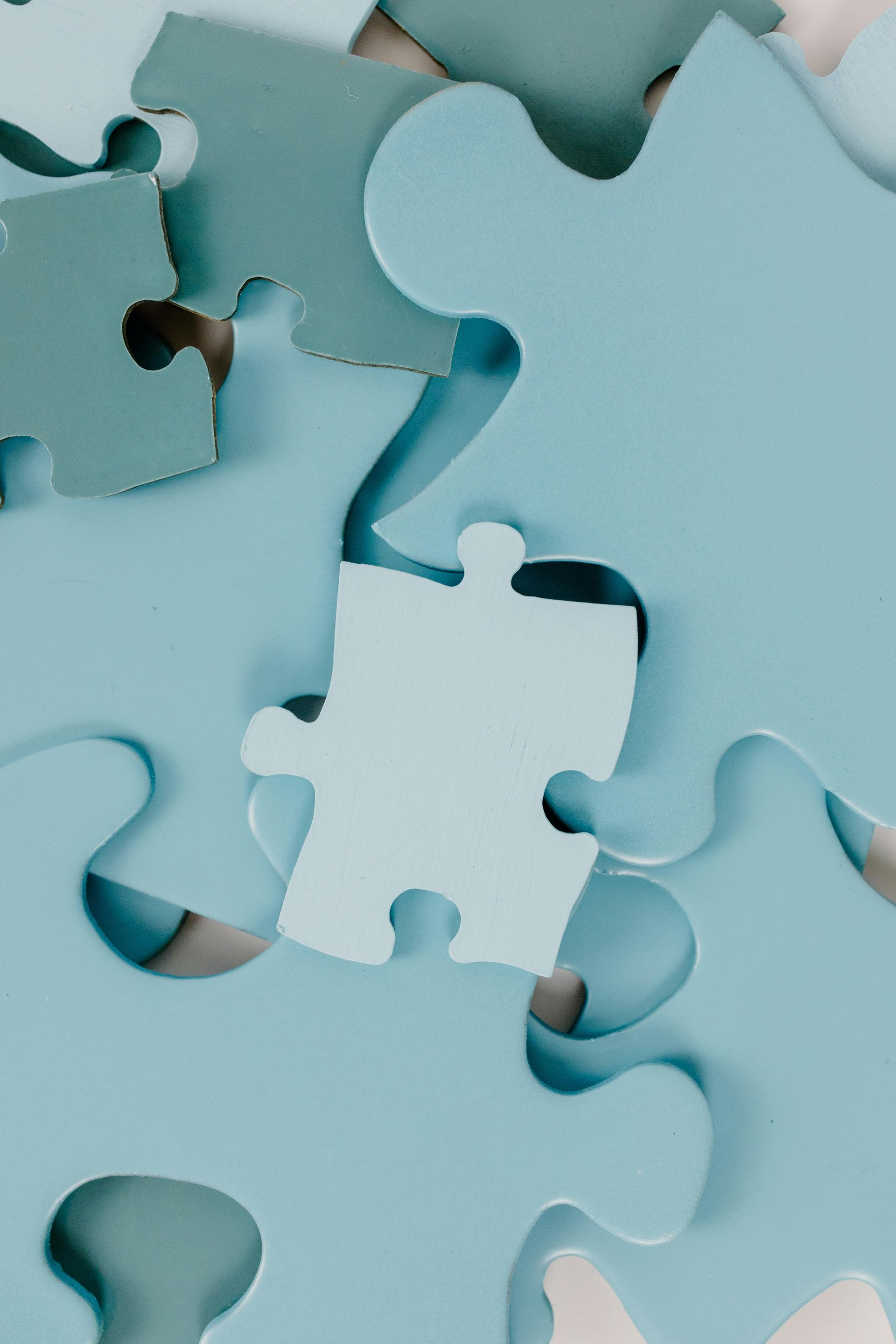 A close up of a puzzle with a piece missing