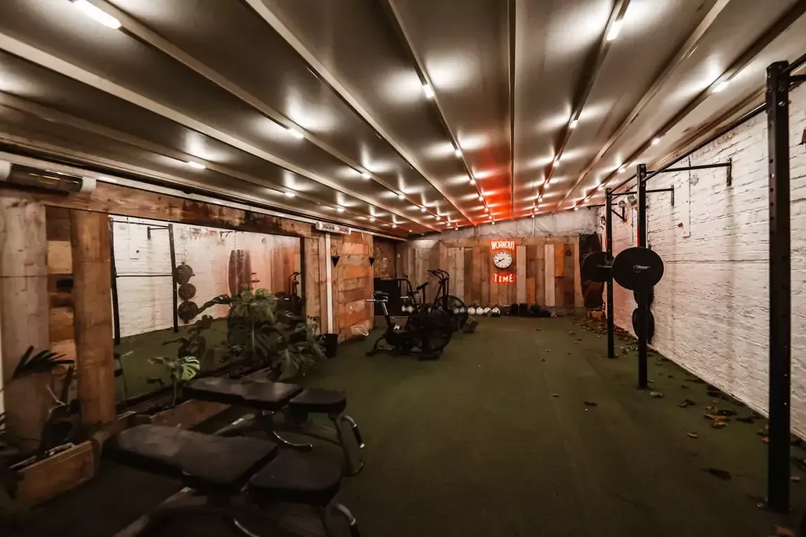 A gym with a lot of equipment and a canopy at Terra Hale, London