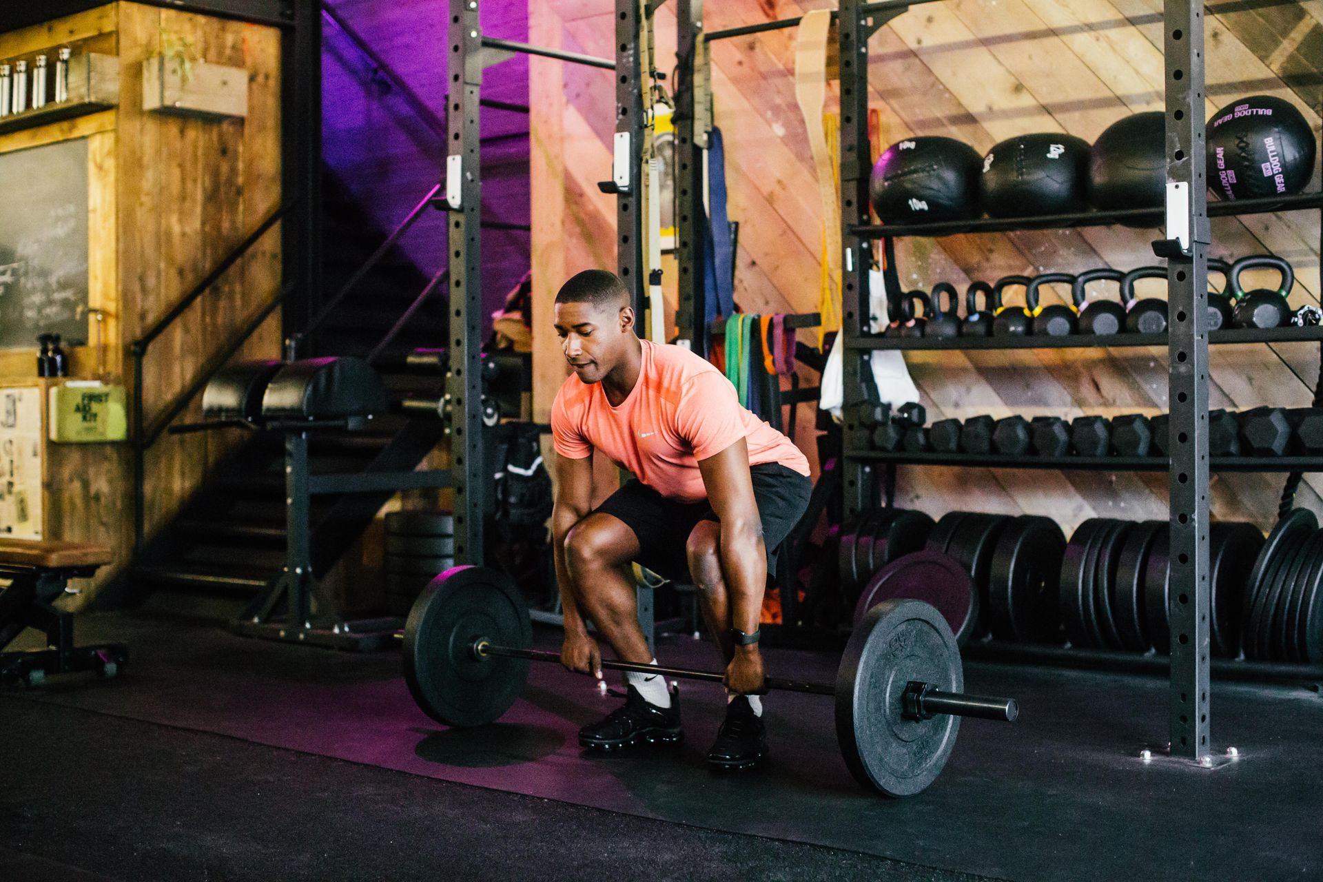 A group of women are doing trx exercises in a gym.