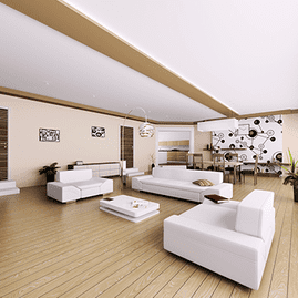 Sala de estar moderna con muebles blancos, suelos de madera y obras de arte en las paredes en un interior luminoso y abierto.