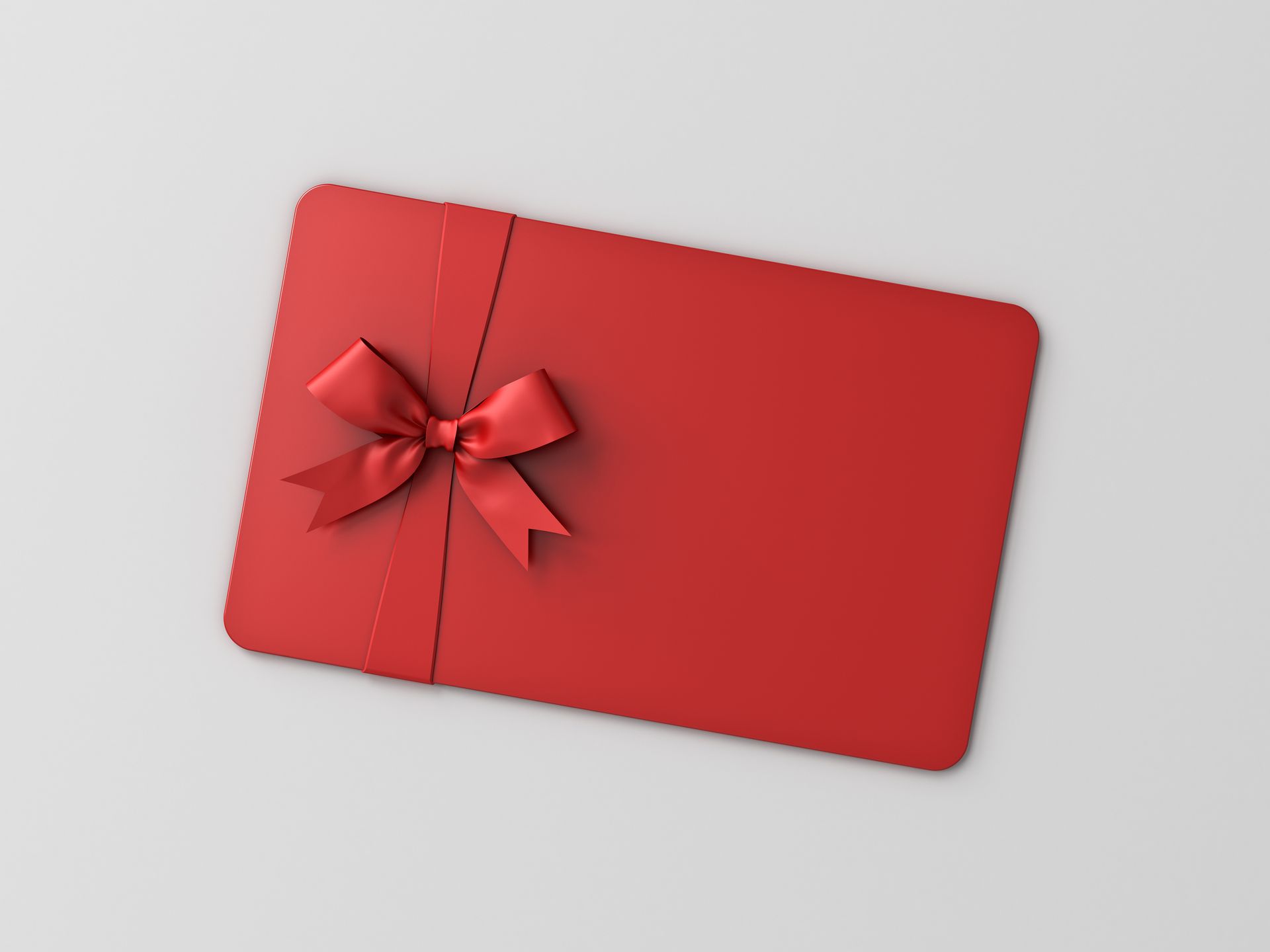 Carte cadeau sur fond gris clair